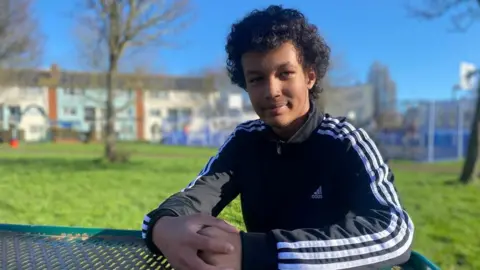 Tegan sat at a table