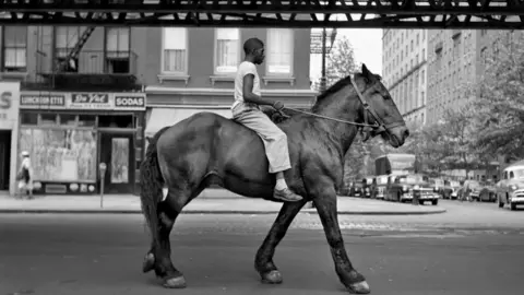 Estate of Vivian Maier and Courtesy of Maloof Coll Photo of person on a horse taken by Vivian Maier in New York in 1953
