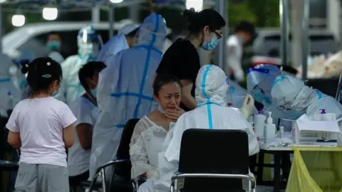 Getty Images Medics taking swabs