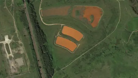 Google Google earth view of large orange ponds at Horden