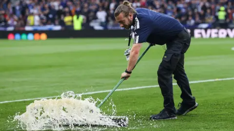 SNS Pitch staff clearing the water