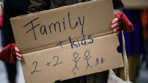 EPA A sign on cardboard that says family + kids