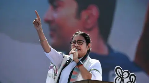 Getty Images Trinamool Congress party leader and Chief Minister of West Bengal, Mamata Banerjee addressing her supporters who are gathered at a mass rally ahead of the upcoming general election in Kolkata on 10 March 2024.