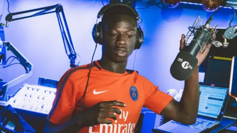 J Hus in the BBC Radio 1xtra studio