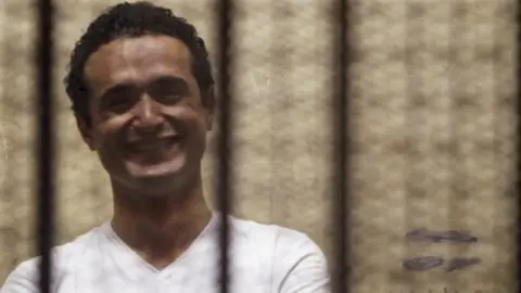 Reuters File photo showing Egyptian activist Ahmed Douma in court outside Cairo on 3 June 2013