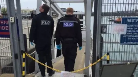 Police at the pontoon ramp of the Inter-Island Quay at St Peter Port Harbour.