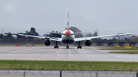 The back of a plane as it taxi's on a runway at Heathrow in 2025.