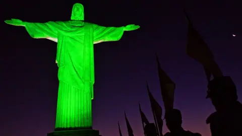 AFP Soldiers in ceremonial costume line up in front of Christ the Redeemer statue in Rio de Janeiro