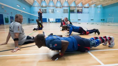 PA Athletes Daniel Kitcher and Frank Aveh doing press-ups