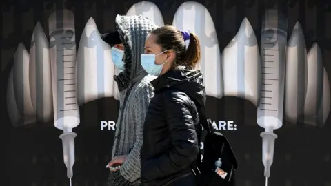 Getty Images People walk past vampire-themed branding