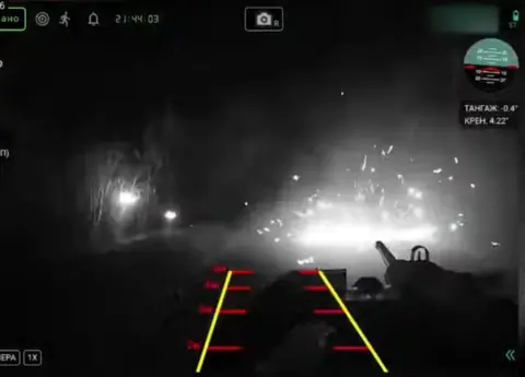 Devdroid A Ukrainian strike UGV firing at a Russian armoured personnel carrier