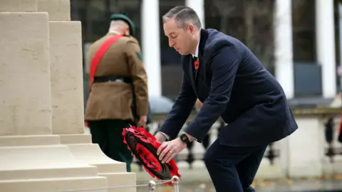 Pacermaker First Minister Paul Givan lays a wreath at the cenotaph in Belfast