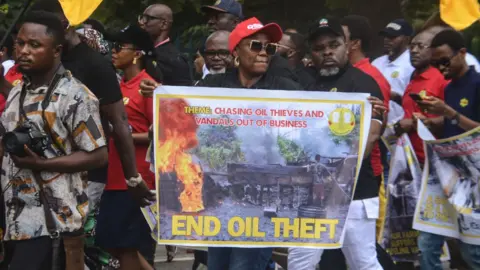 Getty Images Members of the Petroleum and Natural Gas Senior Staff Association of Nigeria (PENGASAN), during a protest over crude oil theft