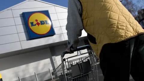 Older shopper going to Lidl