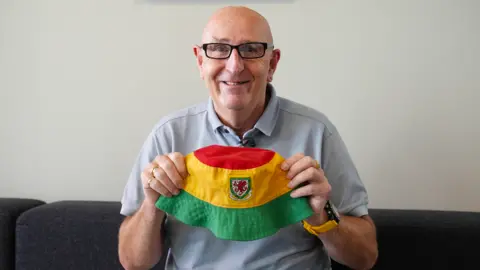 Andy Simonds with the bucket hat that he'd placed on his dashboard - a deliberate nod to his Welshness