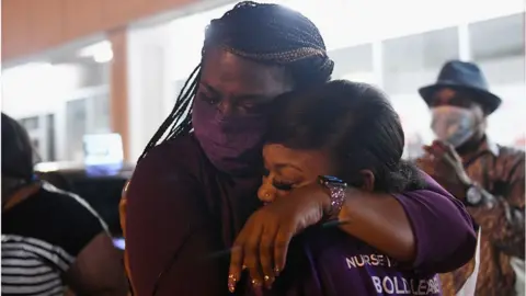 Getty Images Cori Bush hugs her daughter