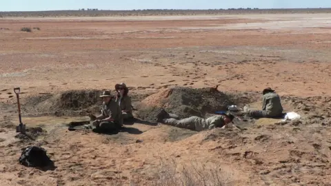 T Worthy/ Flinders University Palaeontologists from Flinders University excavating fossils near Lake Pinpa, South Australia