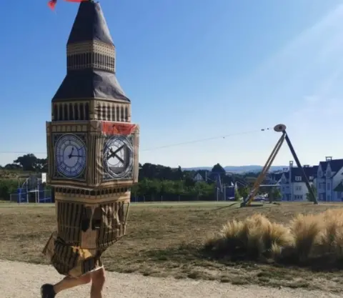 PA Media Simon Phillips in Big Ben costume