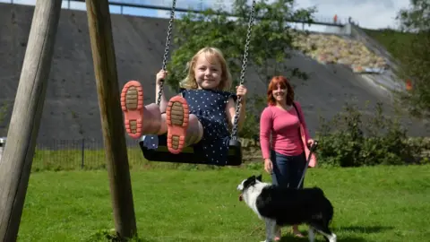 Jacob King/PA Wire Lala Holden on a swing - parental permission given