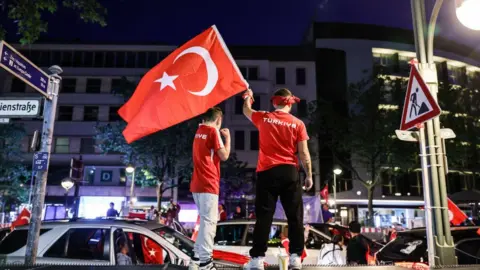 Getty Images Turks in Berlin celebrating Erdogan's election win in May