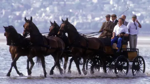 Prince Philip riding across Morecambe Bay in 1985