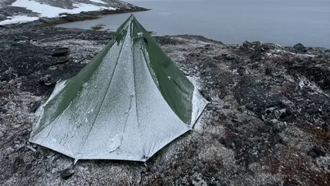 Mike Keen Mike Keen's tent covered in ice near the water in Greenland