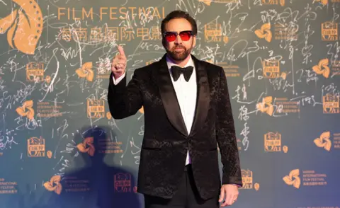 Getty Images File image of Nicholas Cage giving a thumbs-up at the opening ceremony of the Hainan International Film Festival, in China, in 2018