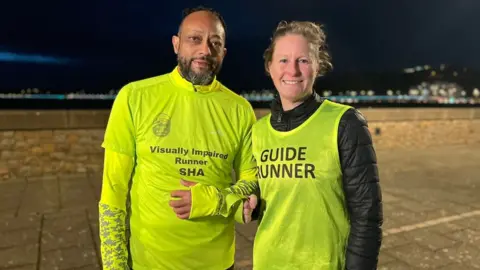 BBC Sha Khan and his guide runner Terri O'Donoghue