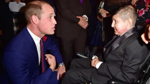 Getty Images Duke of Cambridge greeting Moin Younis at the Pride of Britain Awards in 2017