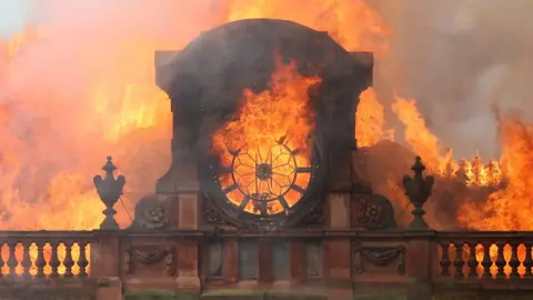 PA Flames destroy the clock at the top of Bank Buildings in Belfast