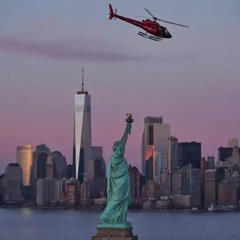 Eric Adams The ill-fated helicopter is seen over the Statue of Liberty
