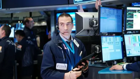 BBC Traders work on the floor of the New York Stock Exchange (NYSE) on March 16, 2020 in New York City.