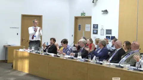 Andrew Sinclair/BBC West Suffolk councillors at a meeting