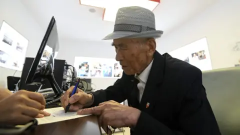 AFP An elderly South Korean man visits the Red Cross office in Seoul on June 22, 2018 to fill out applications for an expected inter-Korean family reunion programme.