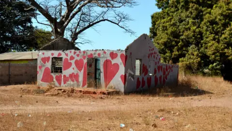 Clare Spencer House painted with hearts - painted by community