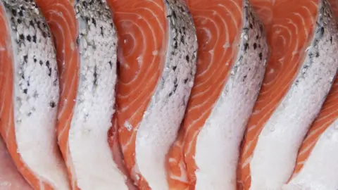 Getty Images Cut salmon on ice