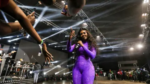 Daniel Irungu/EPA Nigerian singer Tiwa Savage performs at the Walker Town Concert, at the Uhuru Gardens grounds, in Nairobi, Kenya, on 30 September 2023.