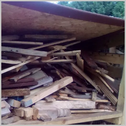 Katie Holden Wood drying out in a shed