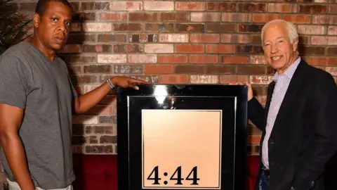 Roc Nation Jay-Z receives his platinum award from the RIAA