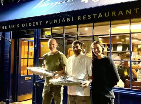 @dulmum / PA Media Mikkel Iversen (left), the founder of Under One Sky, with Leila Al-Baldawi, a volunteer at Under One Sky