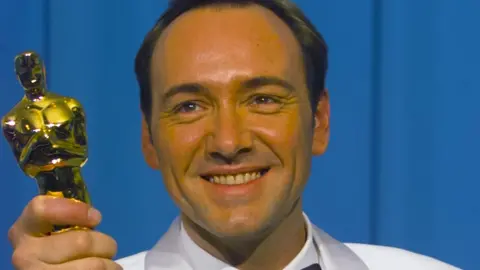 Getty Images Actor Kevin Spacey holding his Oscar trophy for best supporting actor for his role in The Usual Suspects in 1996