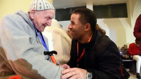 AFP Jean-Pierre Schumacher (L), the last survivor of the monks hostage taking, at the ceremony