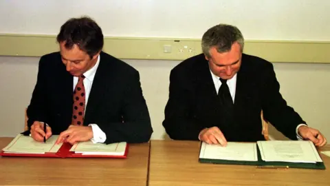 PA Tony Blair and Bertie Ahern signing the Good Friday Agreement
