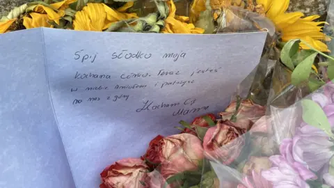 Flowers with a note, handwritten in Polish