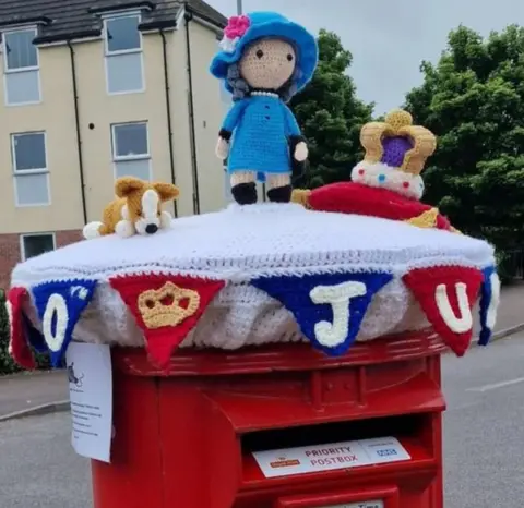 Andrew Cottrell Artworks Post box topper by Westbury Yarn Bombers in Westbury