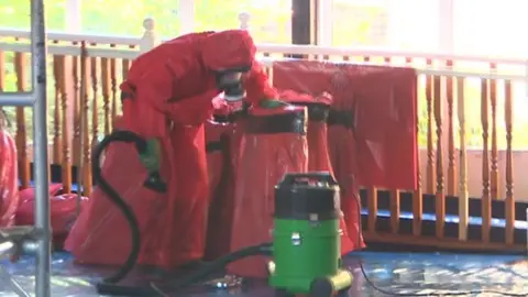 Man removing asbestos at school