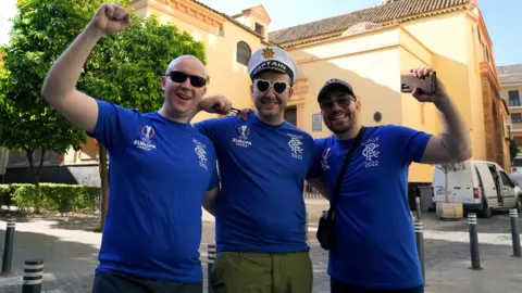 PA Media Rangers fans (left-right) Cameron Fraser, Ross Fraser and Jordan Reid ahead of Wednesday’s UEFA Europa League Final between Eintracht Frankfurt and Rangers