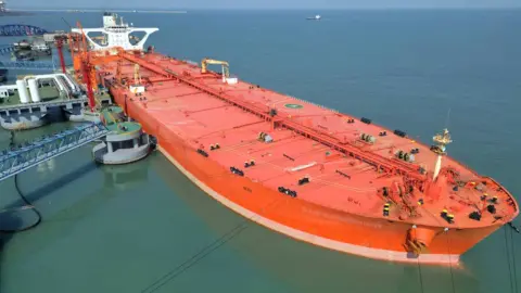Getty Images Aerial view of crude oil tanker 'VIEIRA' unloading oil at the 300,000-ton crude oil terminal of Yantai Port on October 19, 2022
