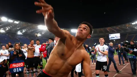 Getty Images Trent Alexander-Arnold celebrates as Liverpool qualify for the Champions League Final