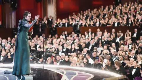 Getty Images Olivia Colman accepts her best actress Oscar